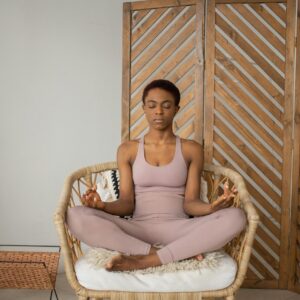 A Woman Doing a Yoga Exercise on a Chair